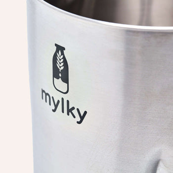 Close-up of Mylky stainless steel jug with logo